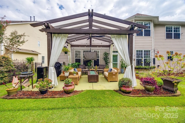 rear view of house featuring a patio area, a pergola, an outdoor hangout area, and a lawn