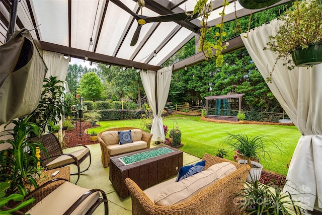 view of patio / terrace featuring an outdoor living space with a fire pit, a fenced backyard, and a pergola