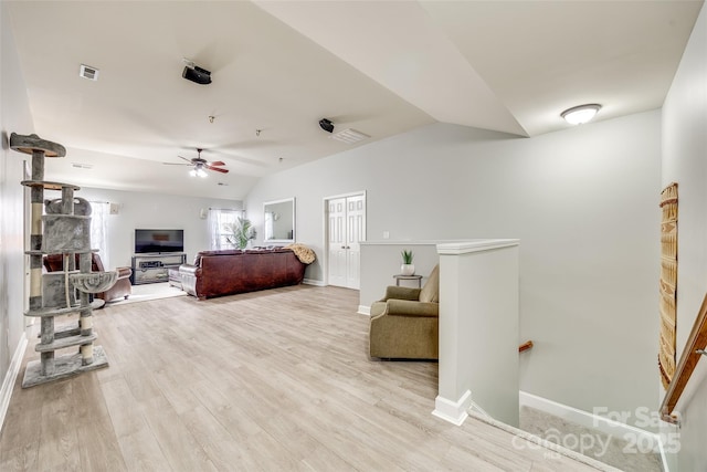 bedroom featuring lofted ceiling, wood finished floors, visible vents, and baseboards