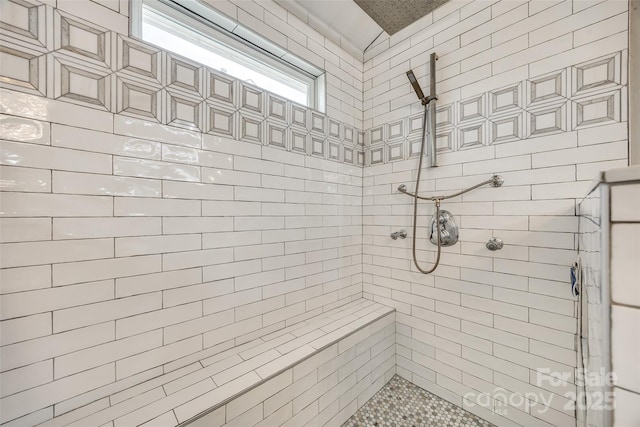 full bath with tiled shower