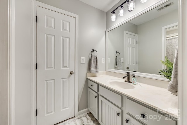 bathroom featuring vanity and visible vents