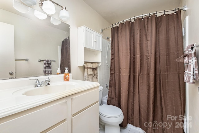 full bathroom with shower / bath combination with curtain, tile patterned flooring, vanity, and toilet