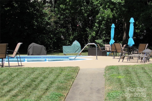 1300 Reece Rd Unit 302, Charlotte, NC 28209 - outdoor pool featuring a patio area, a grill, and a yard