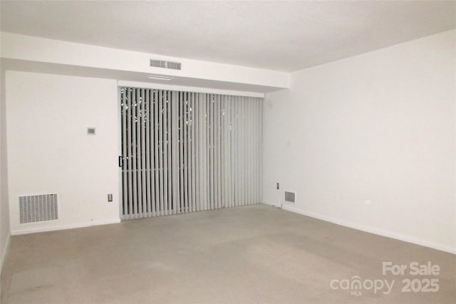 1300 Reece Rd Unit 302, Charlotte, NC 28209 - carpeted empty room featuring baseboards