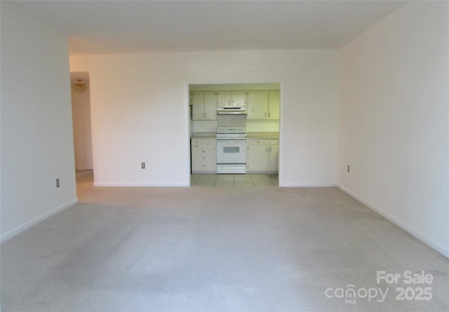 1300 Reece Rd Unit 302, Charlotte, NC 28209 - unfurnished living room with light carpet and baseboards