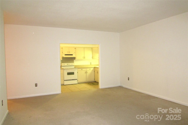 1300 Reece Rd Unit 302, Charlotte, NC 28209 - unfurnished living room with light carpet and baseboards