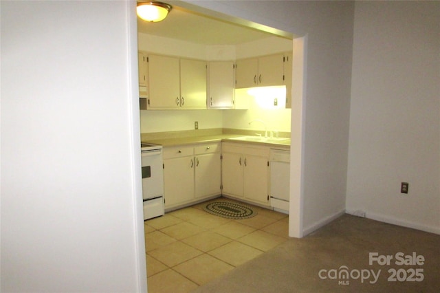 1300 Reece Rd Unit 302, Charlotte, NC 28209 - kitchen featuring white appliances, light countertops, and light tile patterned flooring