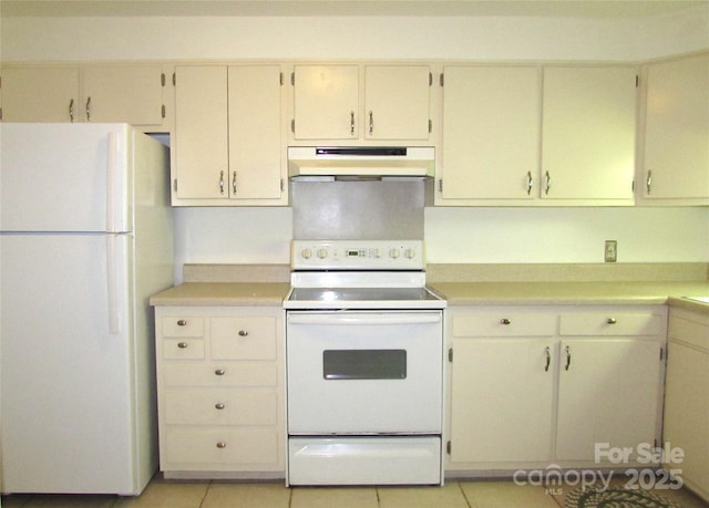 1300 Reece Rd Unit 302, Charlotte, NC 28209 - kitchen with white appliances, under cabinet range hood, light countertops, light tile patterned floors, and cream cabinets