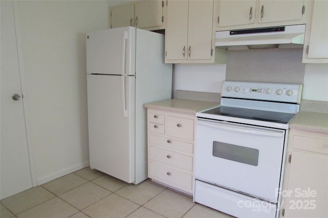 1300 Reece Rd Unit 302, Charlotte, NC 28209 - kitchen with white appliances, under cabinet range hood, light countertops, and light tile patterned floors