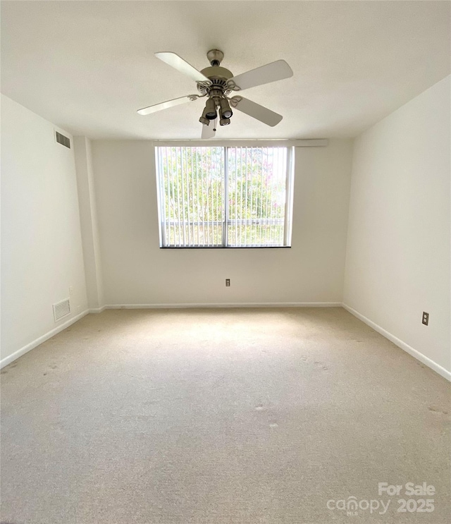 1300 Reece Rd Unit 302, Charlotte, NC 28209 - empty room featuring light carpet and a ceiling fan