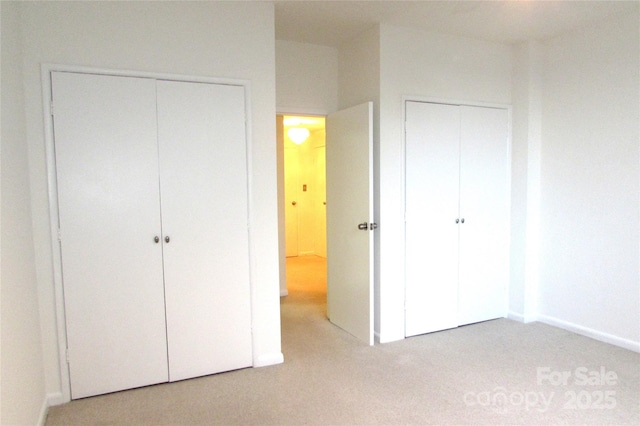 1300 Reece Rd Unit 302, Charlotte, NC 28209 - unfurnished bedroom featuring light carpet and baseboards
