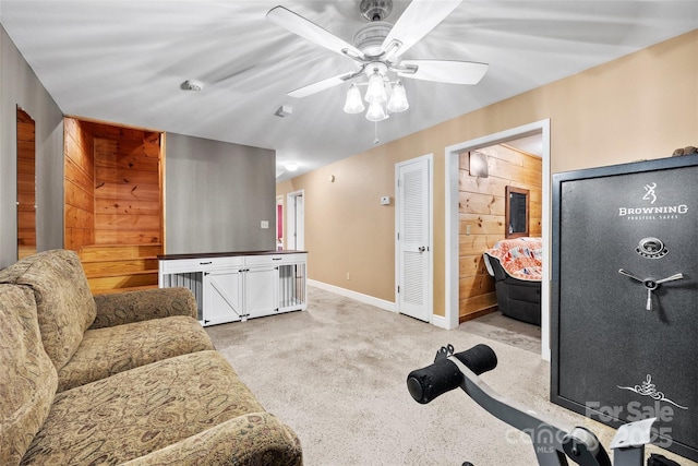 workout area with ceiling fan and light colored carpet