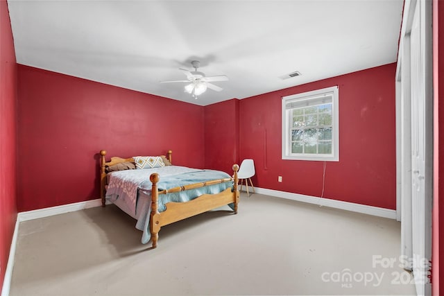 bedroom featuring ceiling fan and concrete flooring