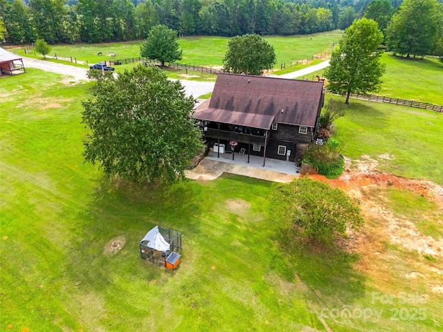 birds eye view of property featuring a rural view