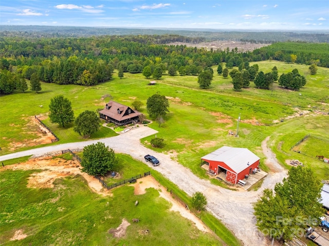 birds eye view of property with a rural view