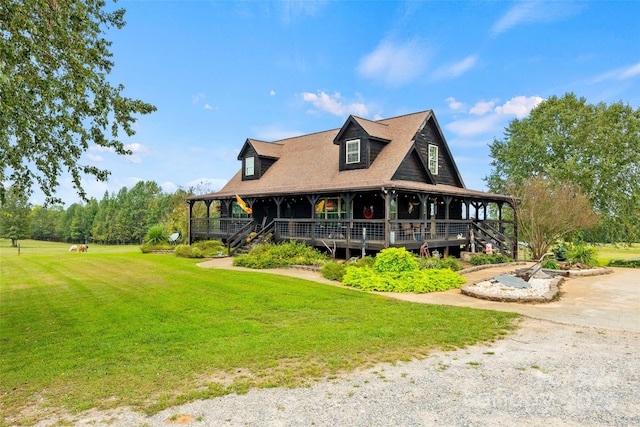 view of front of home with a porch and a front lawn