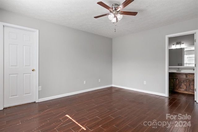 interior space featuring ceiling fan, a textured ceiling, dark hardwood / wood-style floors, and sink