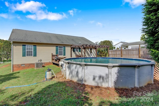 view of pool featuring a pergola and a yard