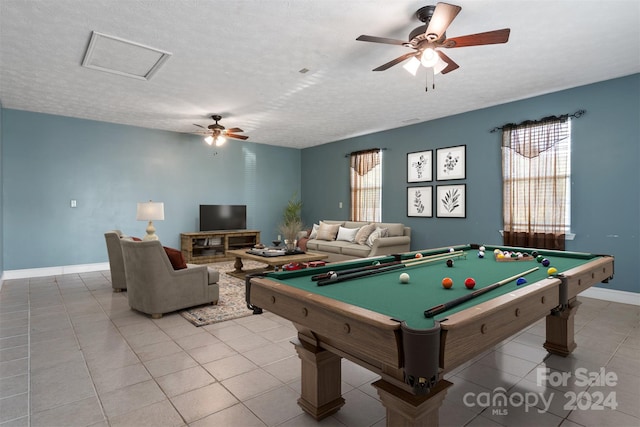 playroom with a textured ceiling, pool table, and ceiling fan