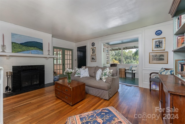 living room featuring hardwood / wood-style floors and a fireplace