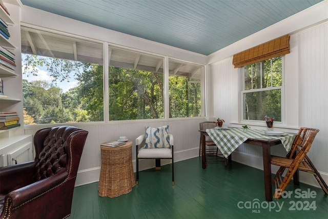 sunroom / solarium featuring wood ceiling