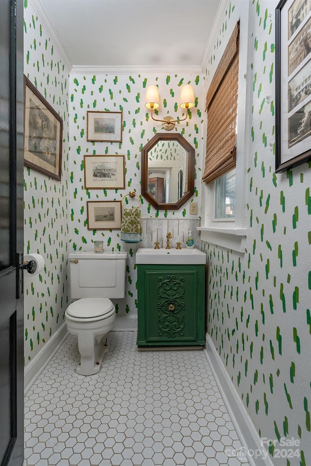 bathroom featuring ornamental molding, vanity, tile patterned floors, and toilet