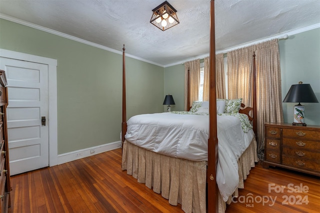 bedroom with wood-type flooring, a textured ceiling, and crown molding