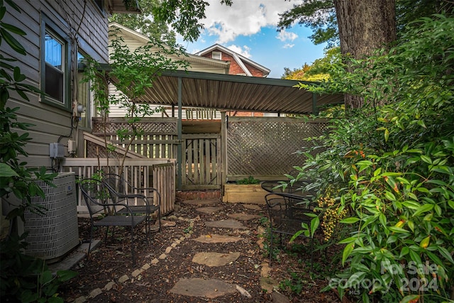 view of patio featuring a deck and central AC unit