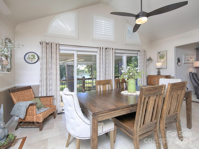 dining area with vaulted ceiling and ceiling fan