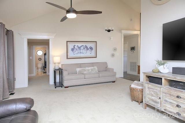 living room with light carpet, ceiling fan, and high vaulted ceiling