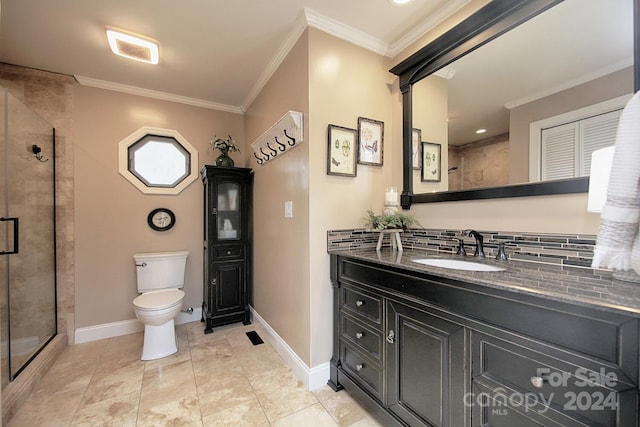 bathroom featuring backsplash, a shower with door, ornamental molding, vanity, and toilet