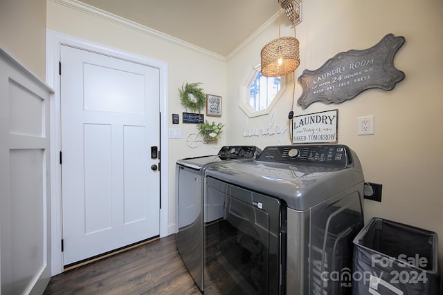 washroom with separate washer and dryer, crown molding, and dark wood-type flooring