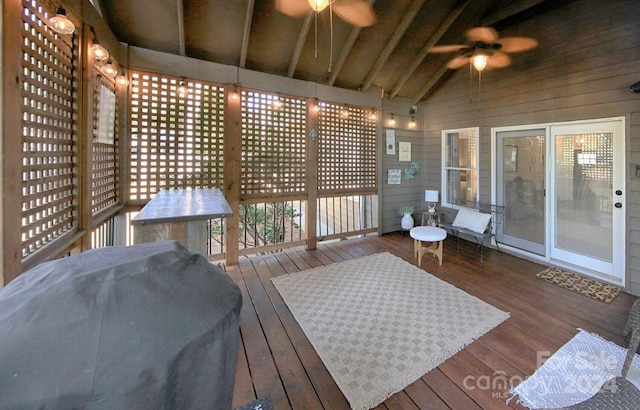 deck featuring ceiling fan and a grill