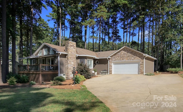 view of front of house with a front yard and a garage