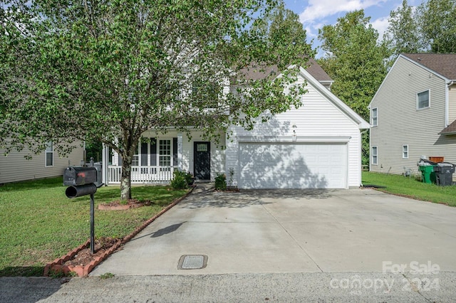 obstructed view of property featuring a front yard and covered porch