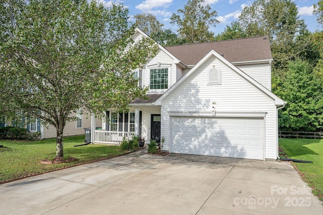 view of front of home featuring covered porch, a front lawn, and a garage