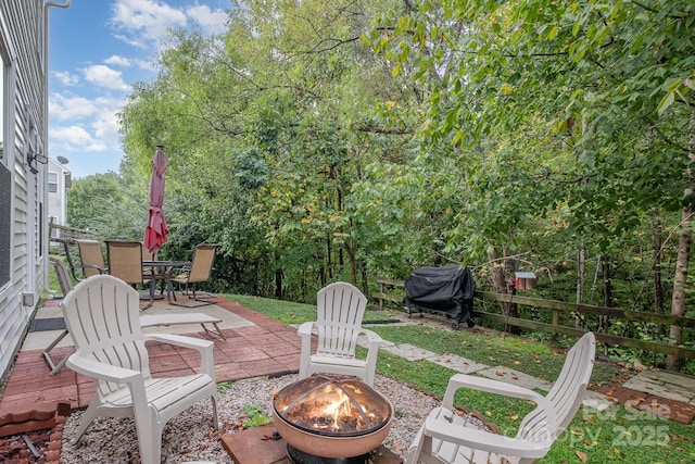 view of patio / terrace with a fire pit