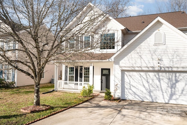 front facade with a garage, central AC unit, and a front lawn