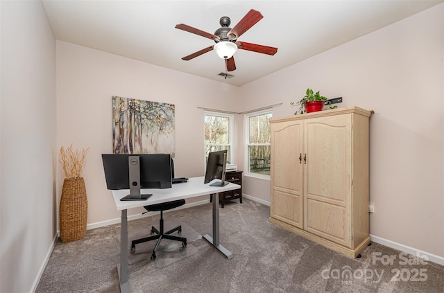 home office with ceiling fan and carpet flooring