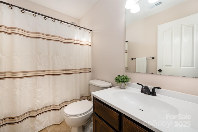 bathroom with toilet and vanity