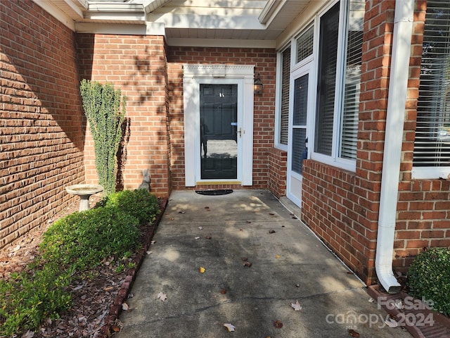 entrance to property with a patio