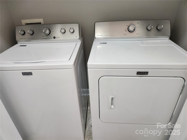 laundry room featuring washer and dryer and laundry area