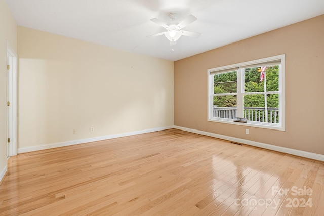 spare room featuring ceiling fan and light wood-type flooring