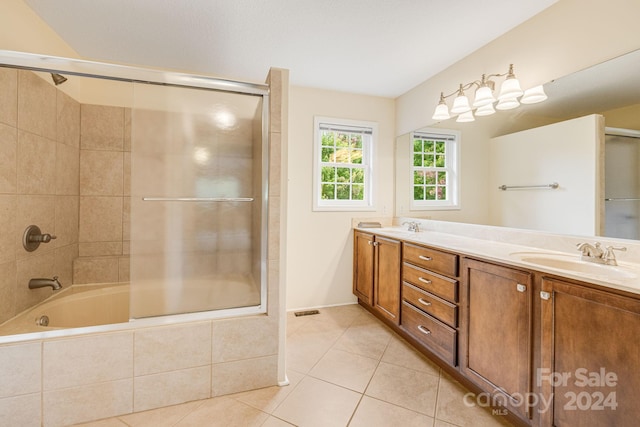 bathroom featuring bath / shower combo with glass door, vanity, and tile patterned floors