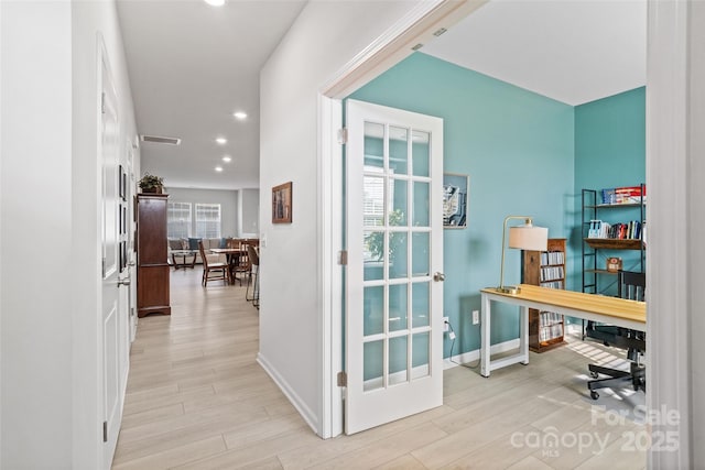 office space with light hardwood / wood-style floors