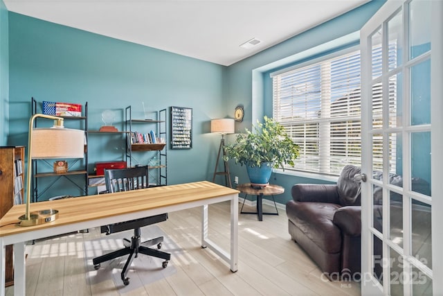 home office featuring hardwood / wood-style floors