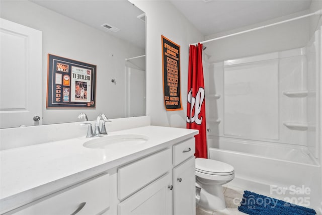 full bathroom featuring tile patterned flooring, vanity, shower / bath combo, and toilet