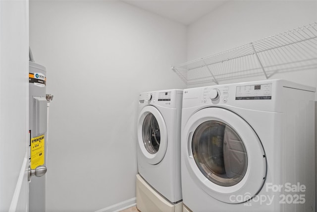 clothes washing area featuring independent washer and dryer