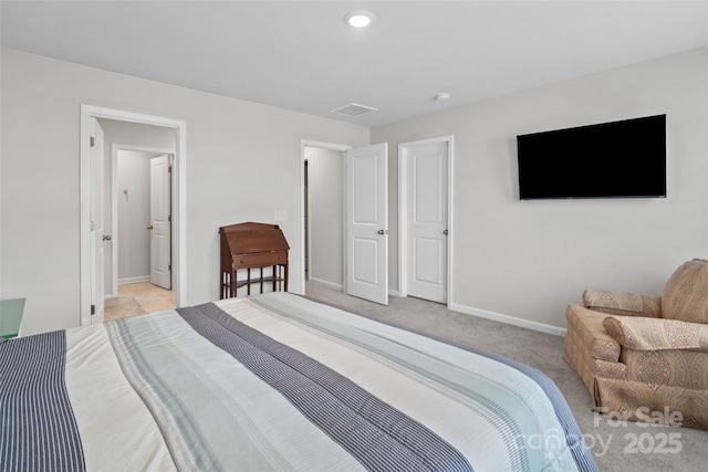 bedroom with light colored carpet