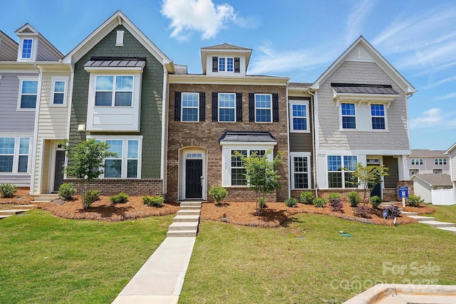 939 Cobbled Way, Fort Mill, SC 29715 - view of property featuring a front yard, a standing seam roof, and brick siding